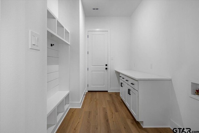 17314 Fm 2767, Tyler, TX 75705 - mudroom featuring wood finished floors and baseboards