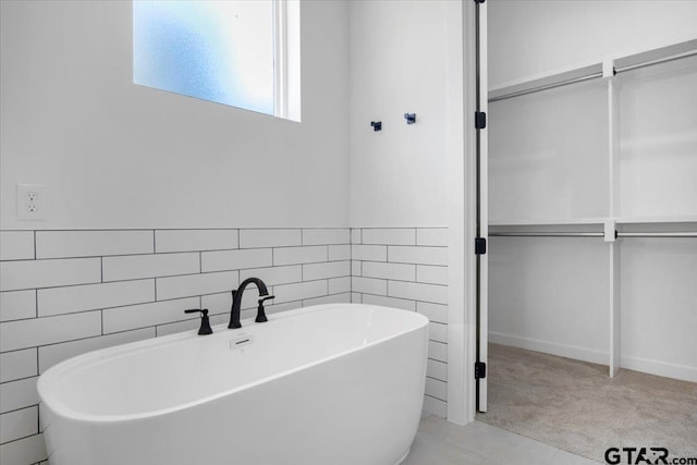 17314 Fm 2767, Tyler, TX 75705 - bathroom with a freestanding tub and tile walls