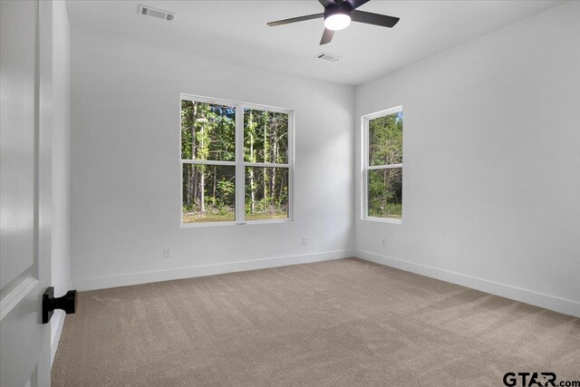 17314 Fm 2767, Tyler, TX 75705 - spare room featuring a ceiling fan, carpet floors, and baseboards