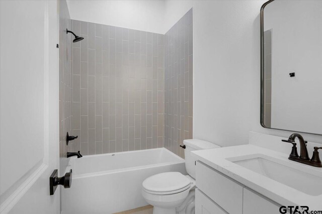 17314 Fm 2767, Tyler, TX 75705 - bathroom featuring vanity, toilet, and shower / washtub combination