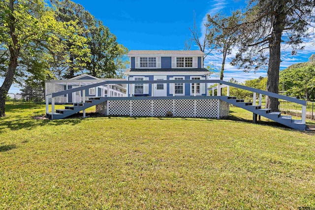 back of house with a yard, stairway, and a deck