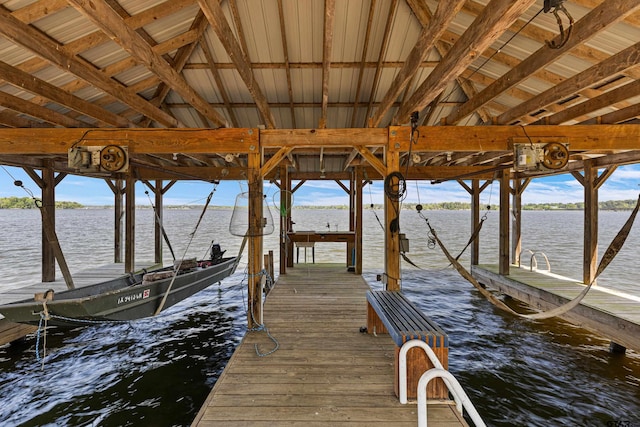 view of dock featuring a water view and boat lift
