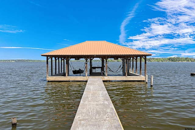 view of dock featuring a water view and boat lift