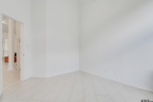 18737 Oakbrook Rd, Tyler, TX 75703 - spare room with light tile patterned flooring and ornate columns