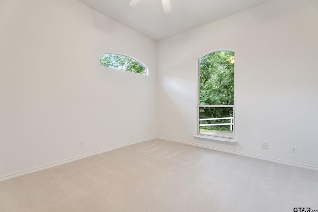 18737 Oakbrook Rd, Tyler, TX 75703 - spare room featuring light carpet, a ceiling fan, and vaulted ceiling