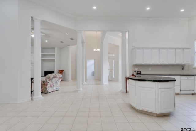 18737 Oakbrook Rd, Tyler, TX 75703 - kitchen featuring ornate columns, dark countertops, white cabinetry, recessed lighting, and crown molding