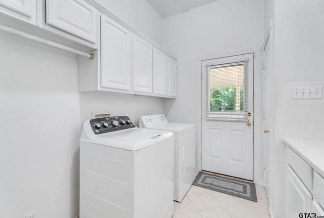 18737 Oakbrook Rd, Tyler, TX 75703 - laundry area featuring cabinet space, washer and dryer, and light tile patterned floors