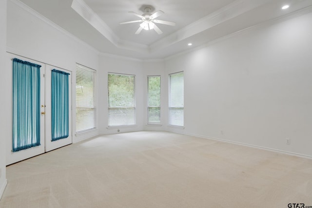 18737 Oakbrook Rd, Tyler, TX 75703 - unfurnished room featuring ornamental molding, light colored carpet, ceiling fan, recessed lighting, and a tray ceiling