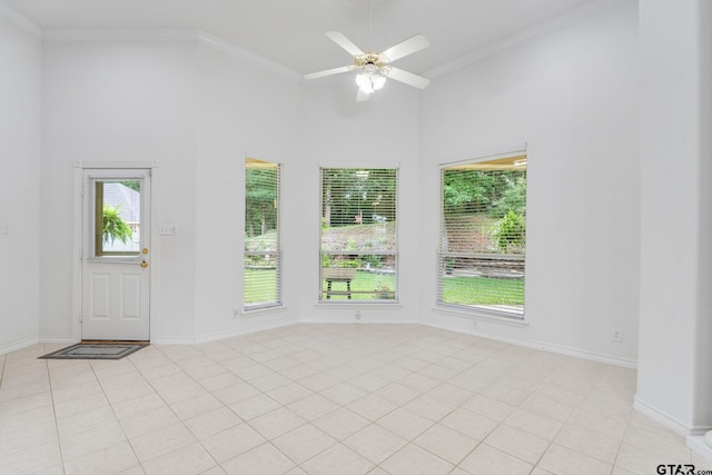 18737 Oakbrook Rd, Tyler, TX 75703 - spare room featuring plenty of natural light, a high ceiling, ceiling fan, ornamental molding, and light tile patterned floors