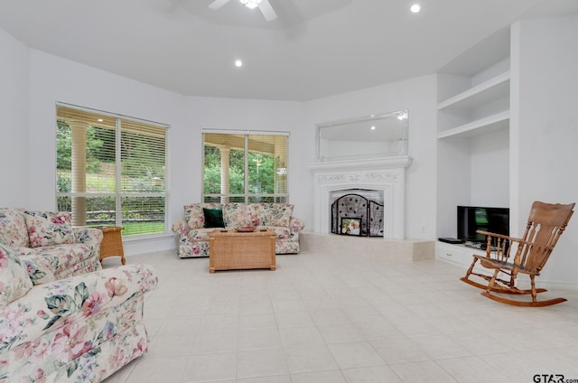 18737 Oakbrook Rd, Tyler, TX 75703 - tiled living room with a fireplace, recessed lighting, and ceiling fan