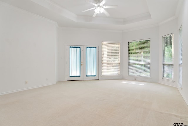 18737 Oakbrook Rd, Tyler, TX 75703 - spare room featuring crown molding, a tray ceiling, light carpet, french doors, and ceiling fan
