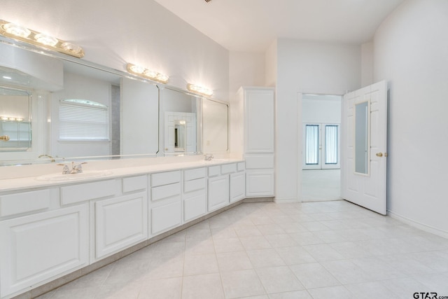 18737 Oakbrook Rd, Tyler, TX 75703 - bathroom featuring double vanity, healthy amount of natural light, and tile patterned flooring