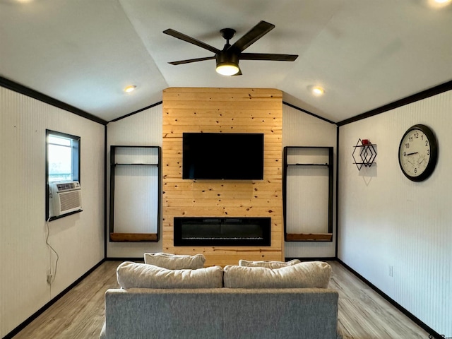 unfurnished living room with light hardwood / wood-style floors, wooden walls, ceiling fan, and vaulted ceiling