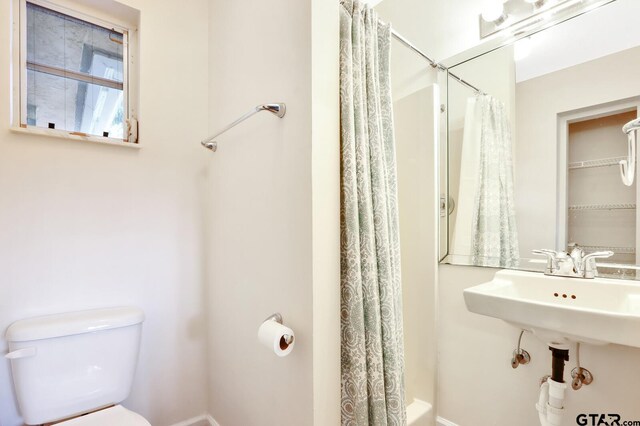 bathroom with sink and toilet