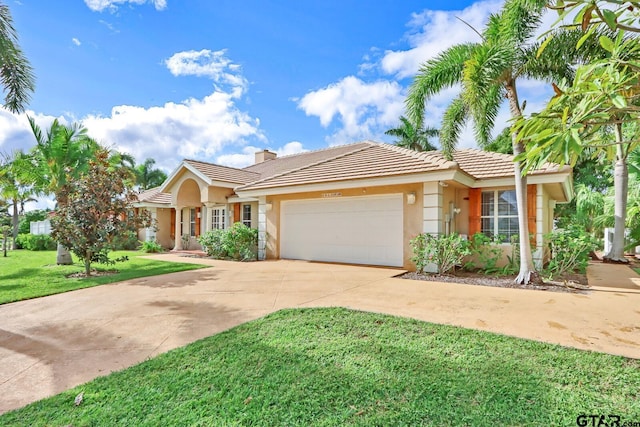 single story home with a garage and a front lawn