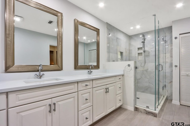 bathroom with vanity and an enclosed shower