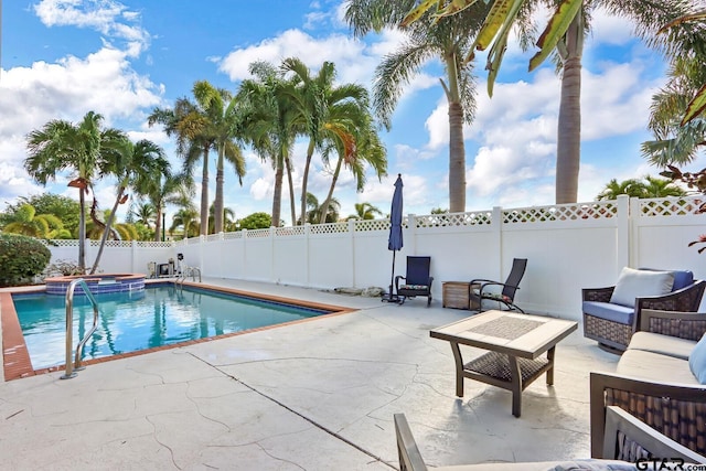 view of pool with an outdoor living space and a patio