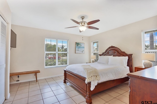 tiled bedroom with ceiling fan