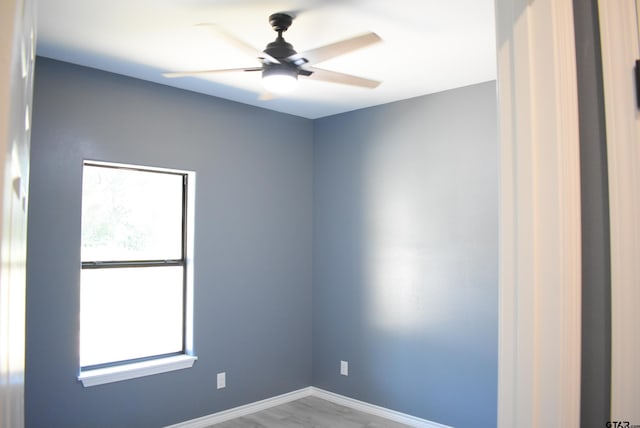 spare room with ceiling fan and light hardwood / wood-style floors