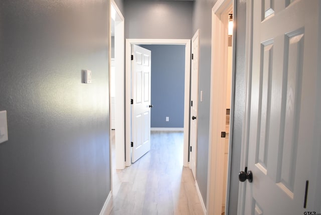 hallway featuring light hardwood / wood-style flooring