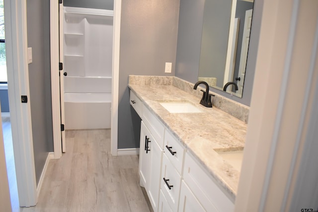 bathroom featuring hardwood / wood-style floors and vanity