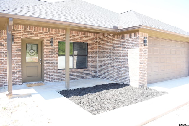 property entrance with a garage