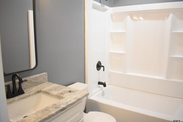 full bathroom with vanity, tub / shower combination, and toilet