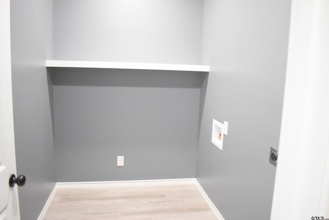 laundry room featuring hardwood / wood-style flooring, electric dryer hookup, and hookup for a washing machine