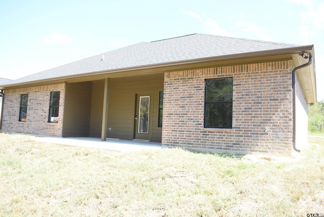 back of property featuring a patio