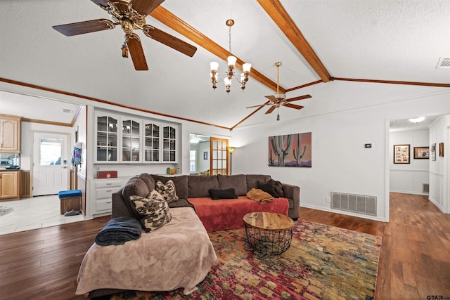 8312 Oxford Dr, Tyler, TX 75703 - living area with a ceiling fan, light wood-style flooring, crown molding, a chandelier, and a textured ceiling