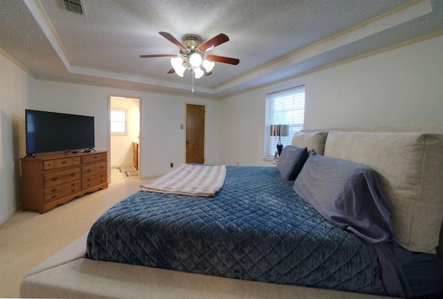 8312 Oxford Dr, Tyler, TX 75703 - bedroom featuring a tray ceiling, carpet floors, crown molding, a textured ceiling, and ceiling fan