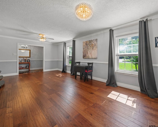 8312 Oxford Dr, Tyler, TX 75703 - living room with a textured ceiling, a chandelier, wood-type flooring, ornamental molding, and ceiling fan