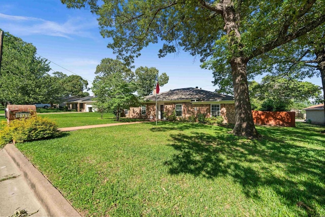 8312 Oxford Dr, Tyler, TX 75703 - view of front of home with a front yard and brick siding