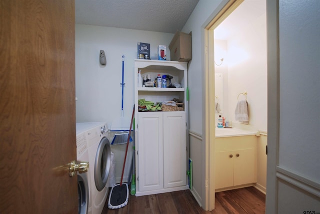 8312 Oxford Dr, Tyler, TX 75703 - laundry room with dark wood finished floors, washer and clothes dryer, and a textured ceiling