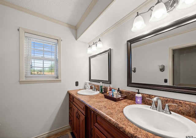 8312 Oxford Dr, Tyler, TX 75703 - bathroom with crown molding, double vanity, and a textured ceiling