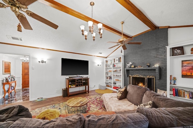 8312 Oxford Dr, Tyler, TX 75703 - living area with a ceiling fan, a chandelier, a brick fireplace, built in shelves, and ornamental molding