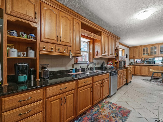 8312 Oxford Dr, Tyler, TX 75703 - kitchen featuring open shelves, stainless steel appliances, brown cabinets, a textured ceiling, and tasteful backsplash