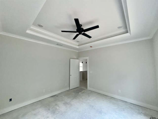 2514 N Glass, Tyler, TX 75702 - unfurnished bedroom with a tray ceiling, unfinished concrete flooring, ornamental molding, baseboards, and a ceiling fan