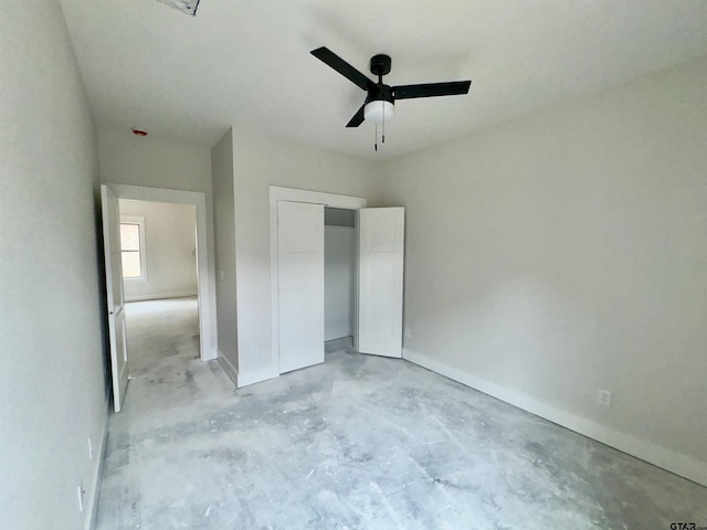 2514 N Glass, Tyler, TX 75702 - unfurnished bedroom with unfinished concrete floors, a closet, baseboards, and a ceiling fan