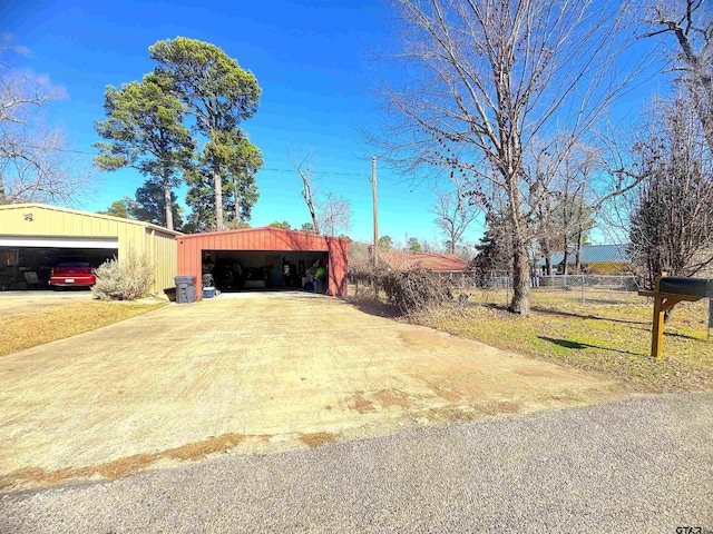 view of front of property featuring an outbuilding and a garage