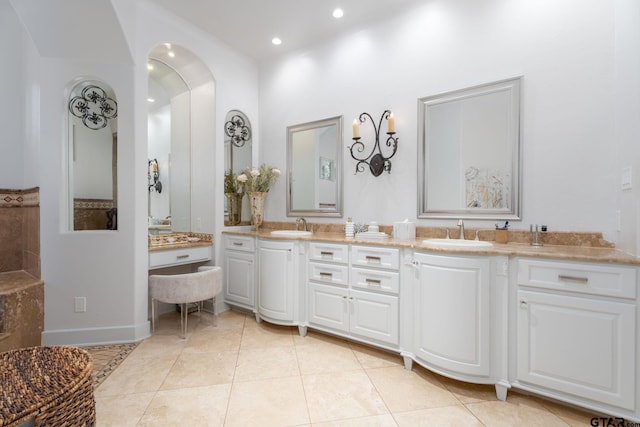 bathroom featuring tile patterned flooring and vanity