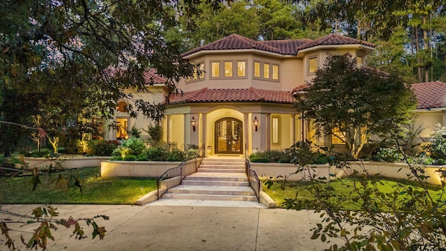 mediterranean / spanish-style house with french doors