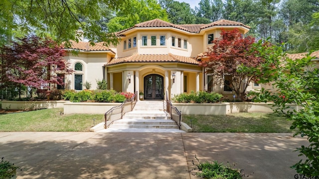 mediterranean / spanish-style house featuring french doors