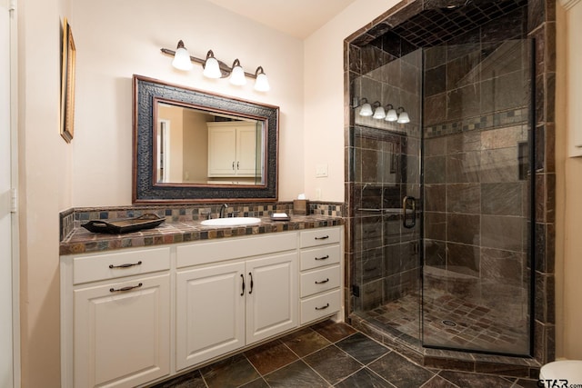 bathroom featuring vanity and a shower with shower door