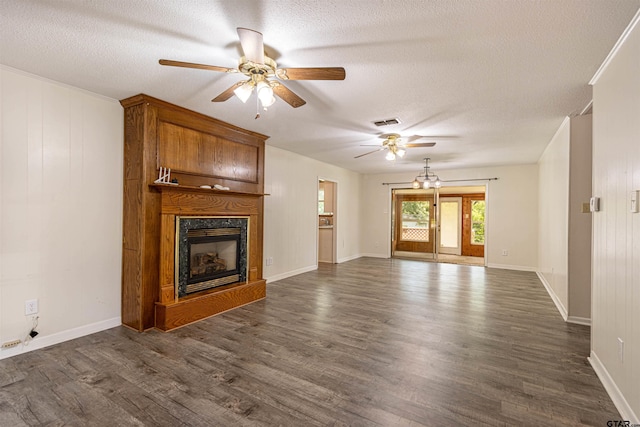 405 Brookview Ln, Palestine, TX 75803 - unfurnished living room featuring ceiling fan, a textured ceiling, a premium fireplace, and dark wood-type flooring