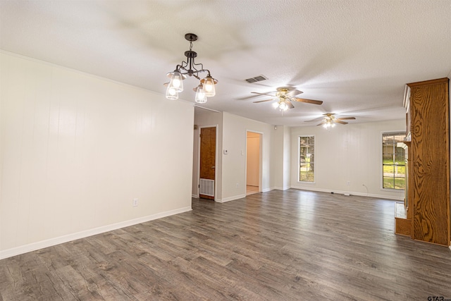 405 Brookview Ln, Palestine, TX 75803 - spare room with dark wood-type flooring, ceiling fan, a chandelier, and a textured ceiling