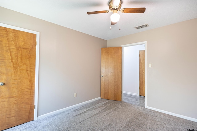 405 Brookview Ln, Palestine, TX 75803 - unfurnished bedroom featuring carpet flooring and a ceiling fan