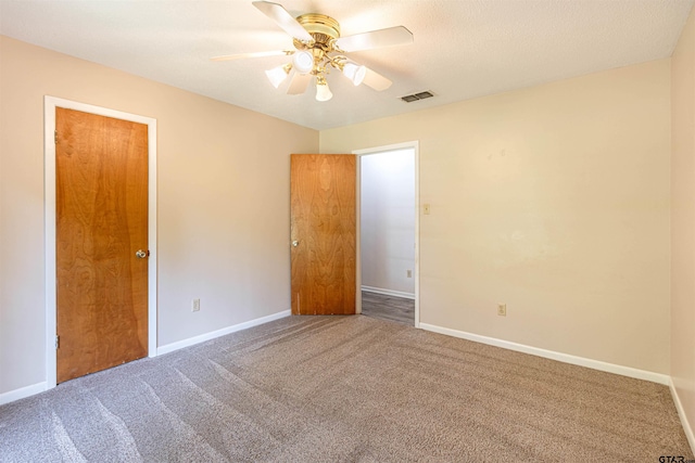 405 Brookview Ln, Palestine, TX 75803 - unfurnished bedroom with carpet floors and a ceiling fan