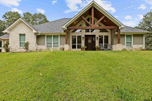 craftsman inspired home with a front lawn