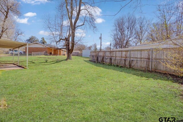 view of yard featuring fence